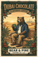 Bear & Pine Dubai Chocolate flavored coffee artwork featuring a bear enjoying coffee on a stone terrace overlooking golden desert dunes and a distant skyline.